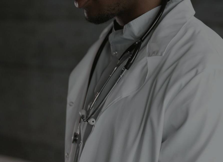 black doctor wearing lab coat